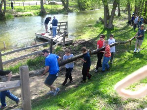 6th graders remove debris from the river.