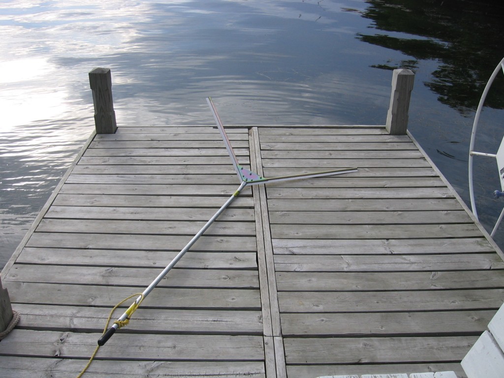 dock on Pewaukee Lake with weed rake
